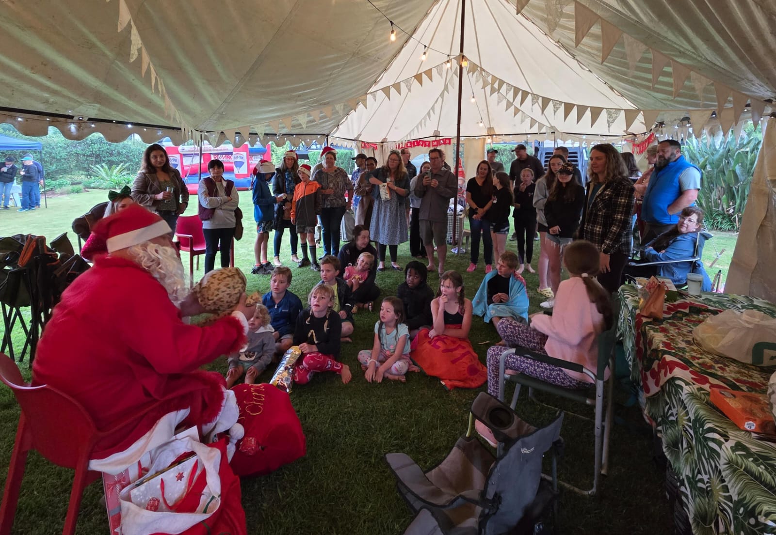 Santa visiting children at the year-end celebration